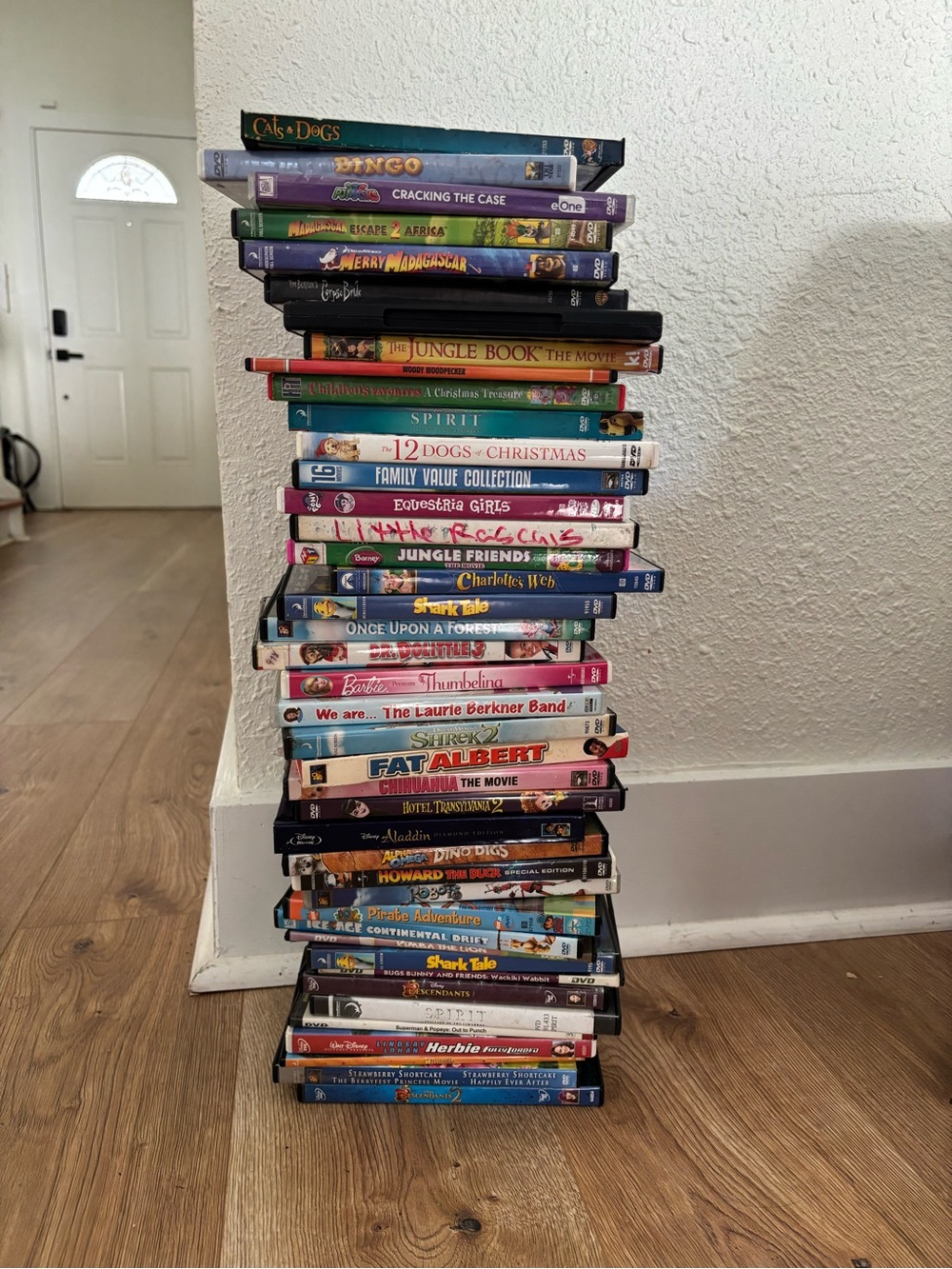 Stacked Assorted DVD Movies. Family genre